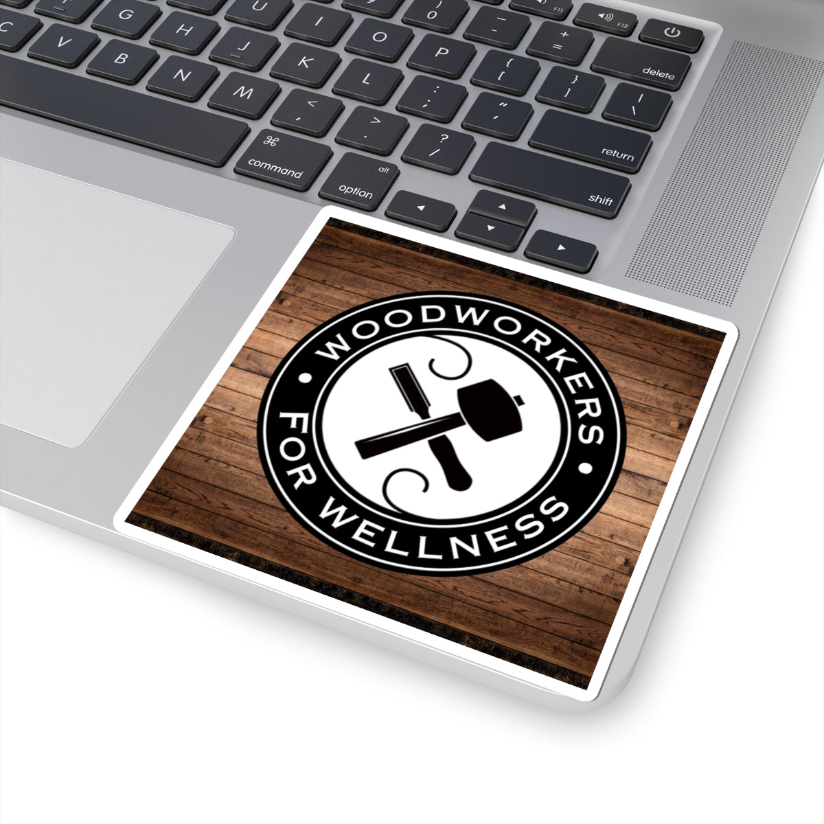Woodworkers For Wellness Sticker. w/ Wood Background