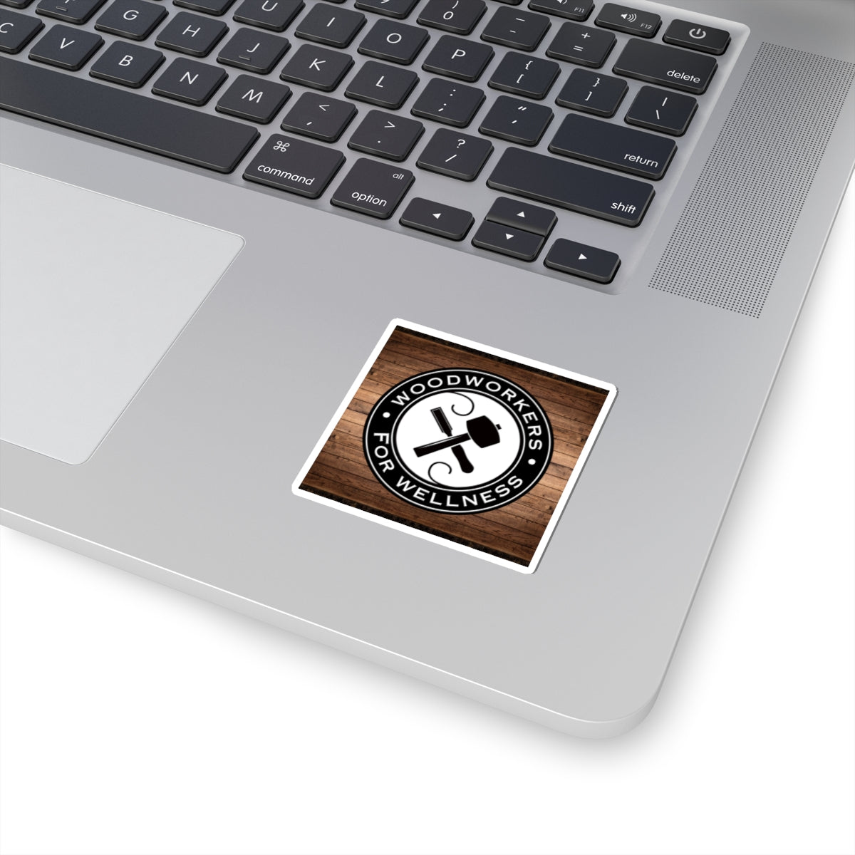 Woodworkers For Wellness Sticker. w/ Wood Background