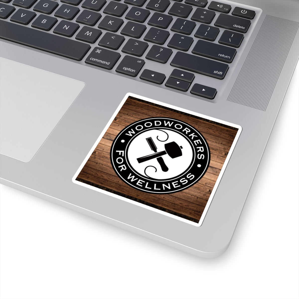 Woodworkers For Wellness Sticker. w/ Wood Background